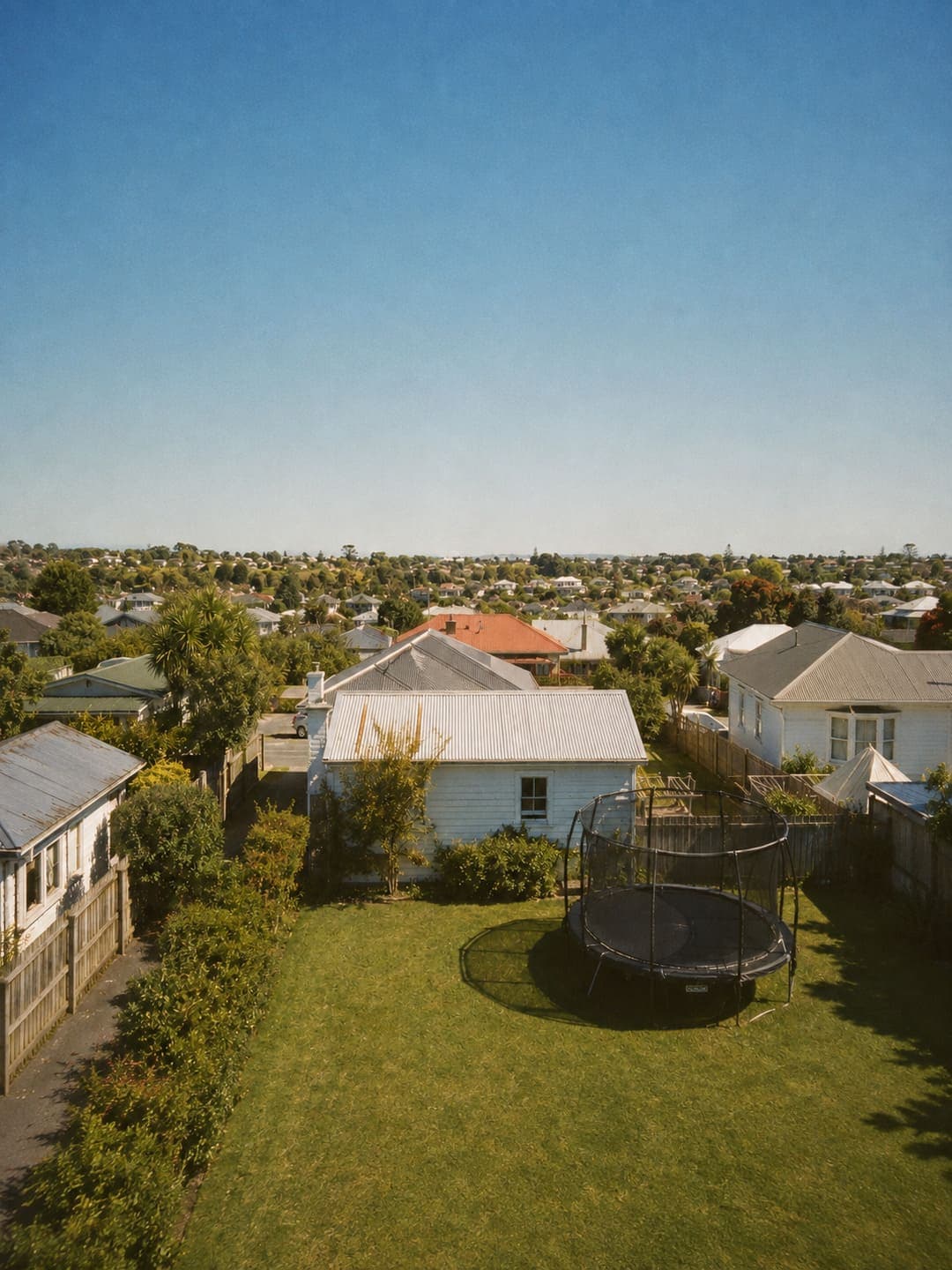 Overhead view of a trampoline in an Auckland backyard
